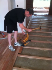 floor layer installing timber flooring